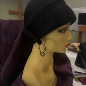 Elegant Black Hat with Gold Hoop Earrings